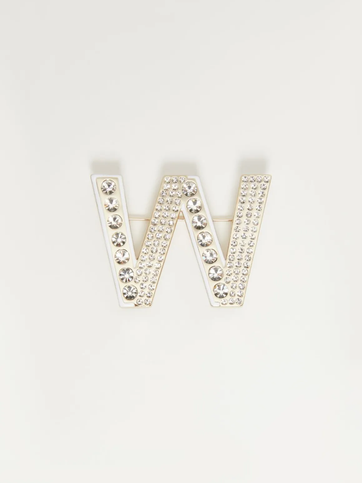 Metal brooch with rhinestones
