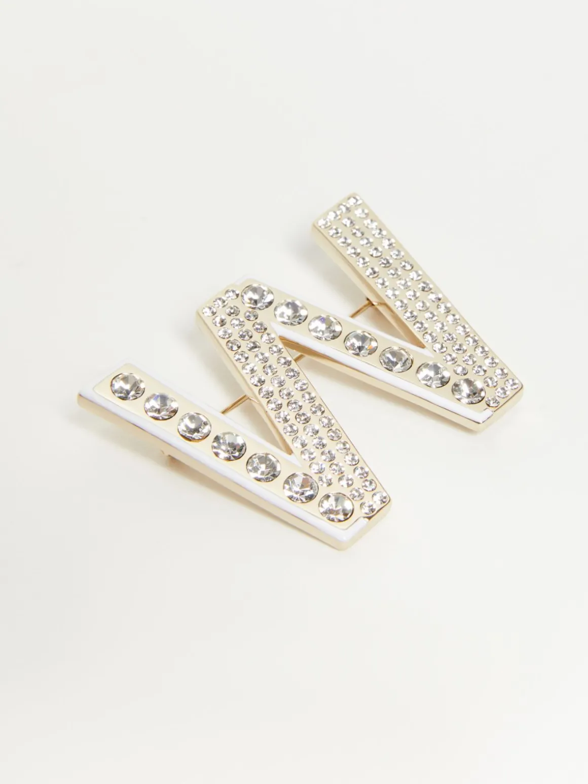 Metal brooch with rhinestones