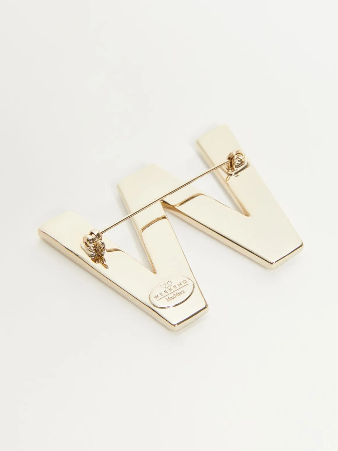 Metal brooch with rhinestones