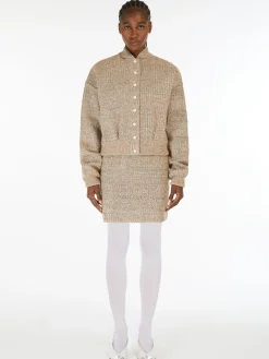 Mini skirt in knit fabric with rubber-coated yarn