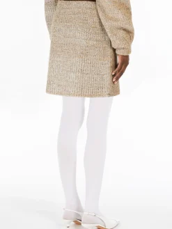 Mini skirt in knit fabric with rubber-coated yarn