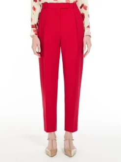 Wool satin carrot-leg trousers.